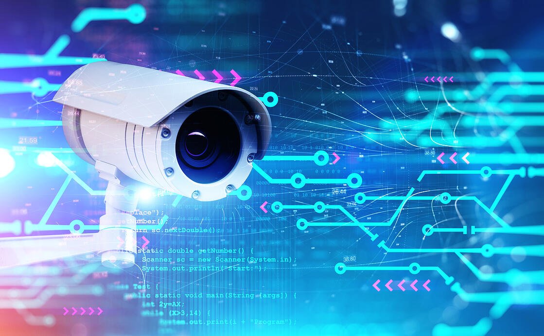 Camera against circuit symbolizing website monitoring