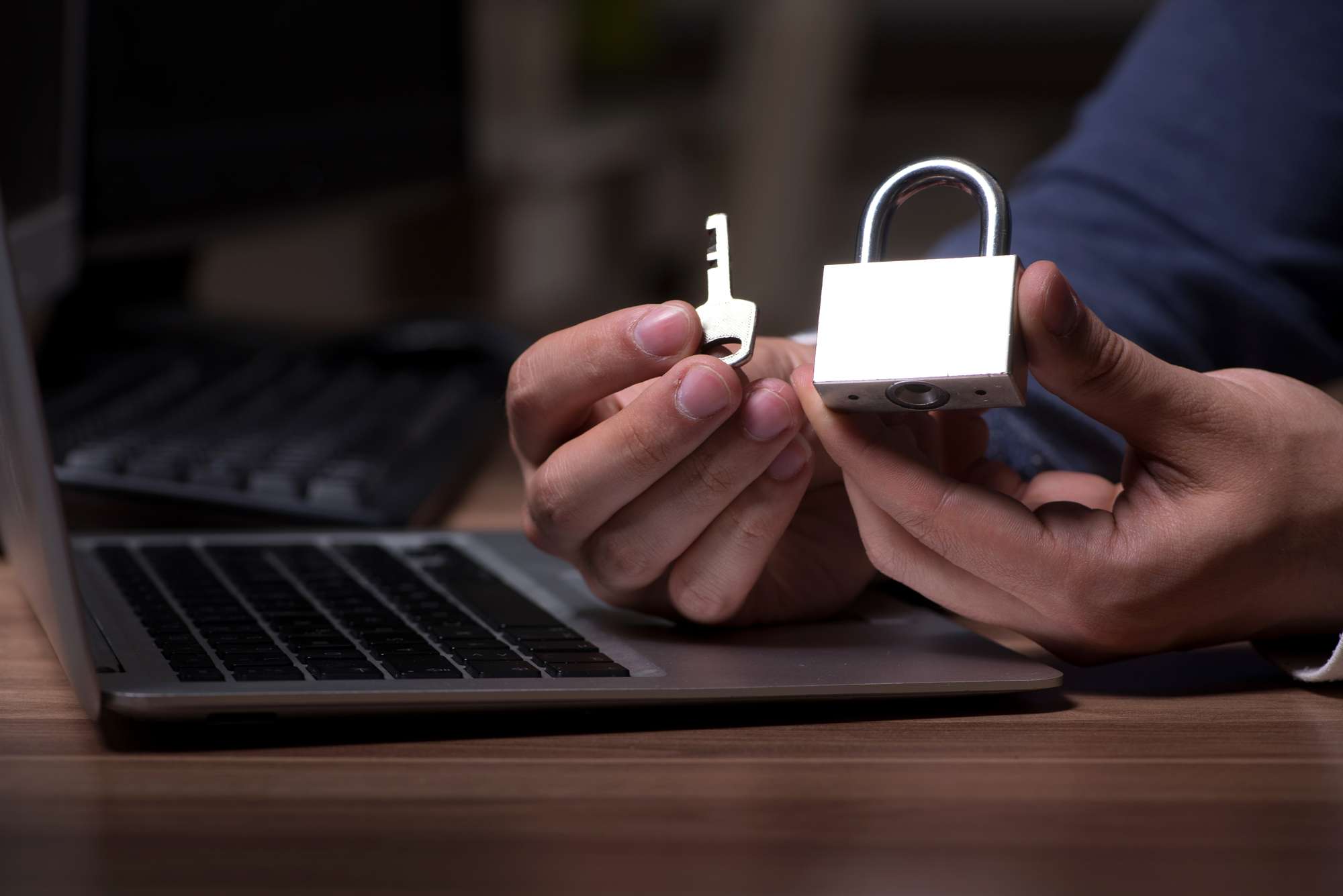ransomware update showing hacker unlocking a padlock