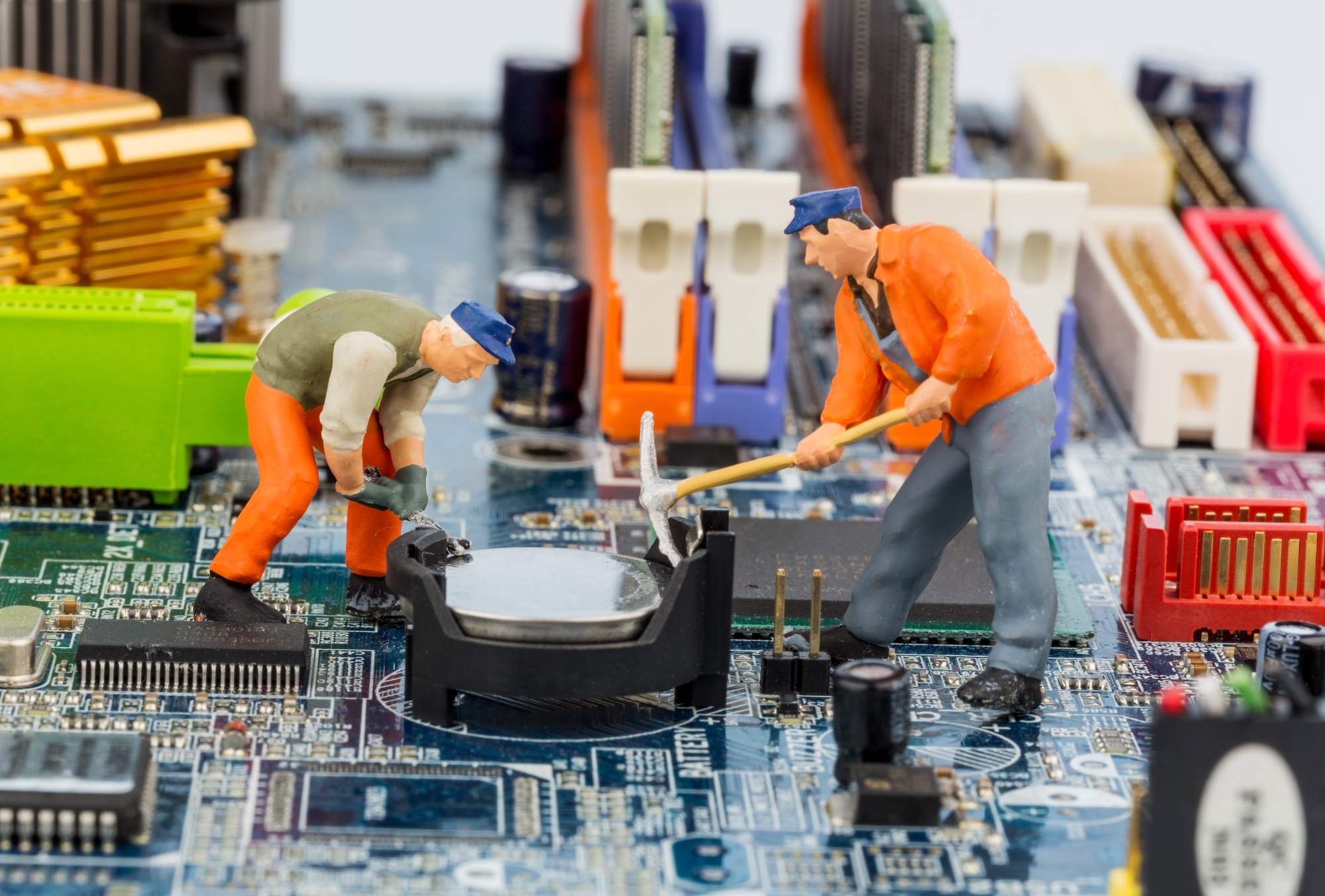 image of toy men on computer board demonstrating proactive IT maintenance